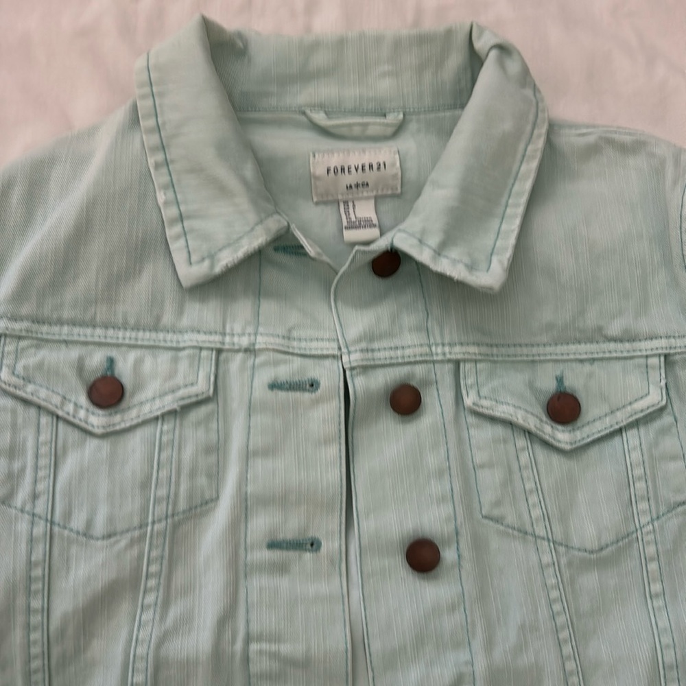 Forever 21 powder blue jeans jacket. L all buttons intact.2breast pockets 2waist